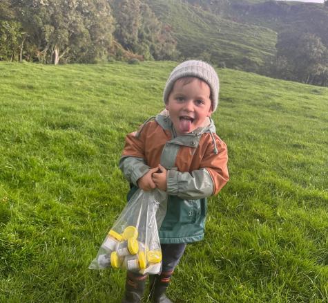image of boy collecting poo samples