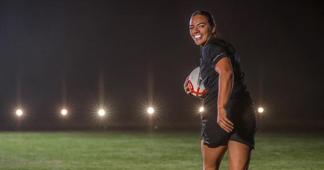 image of Stacey Waka looking back with a rugby ball